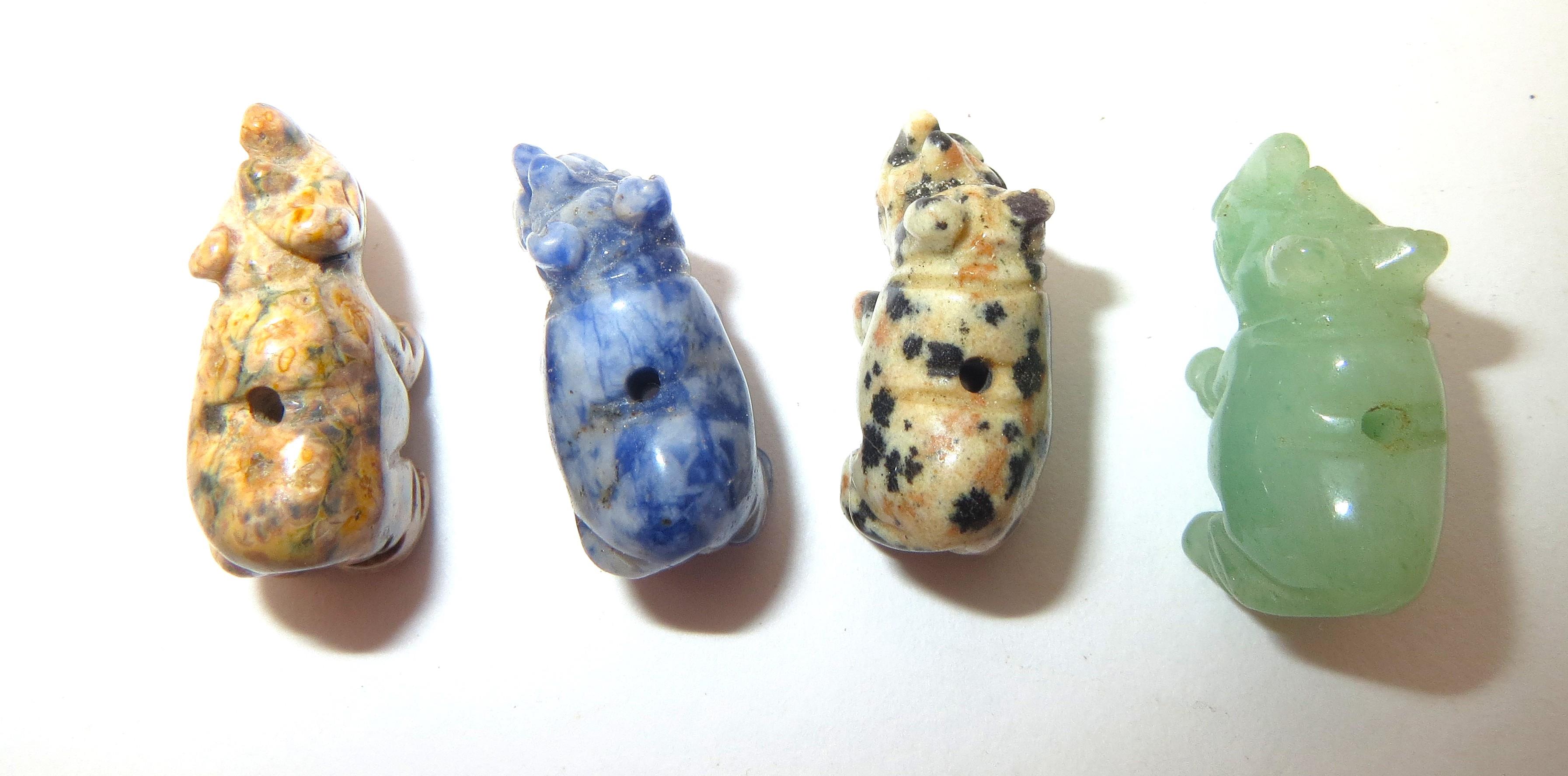 Image for Gemstone hand carved Rhino Beads miniatures set of 4